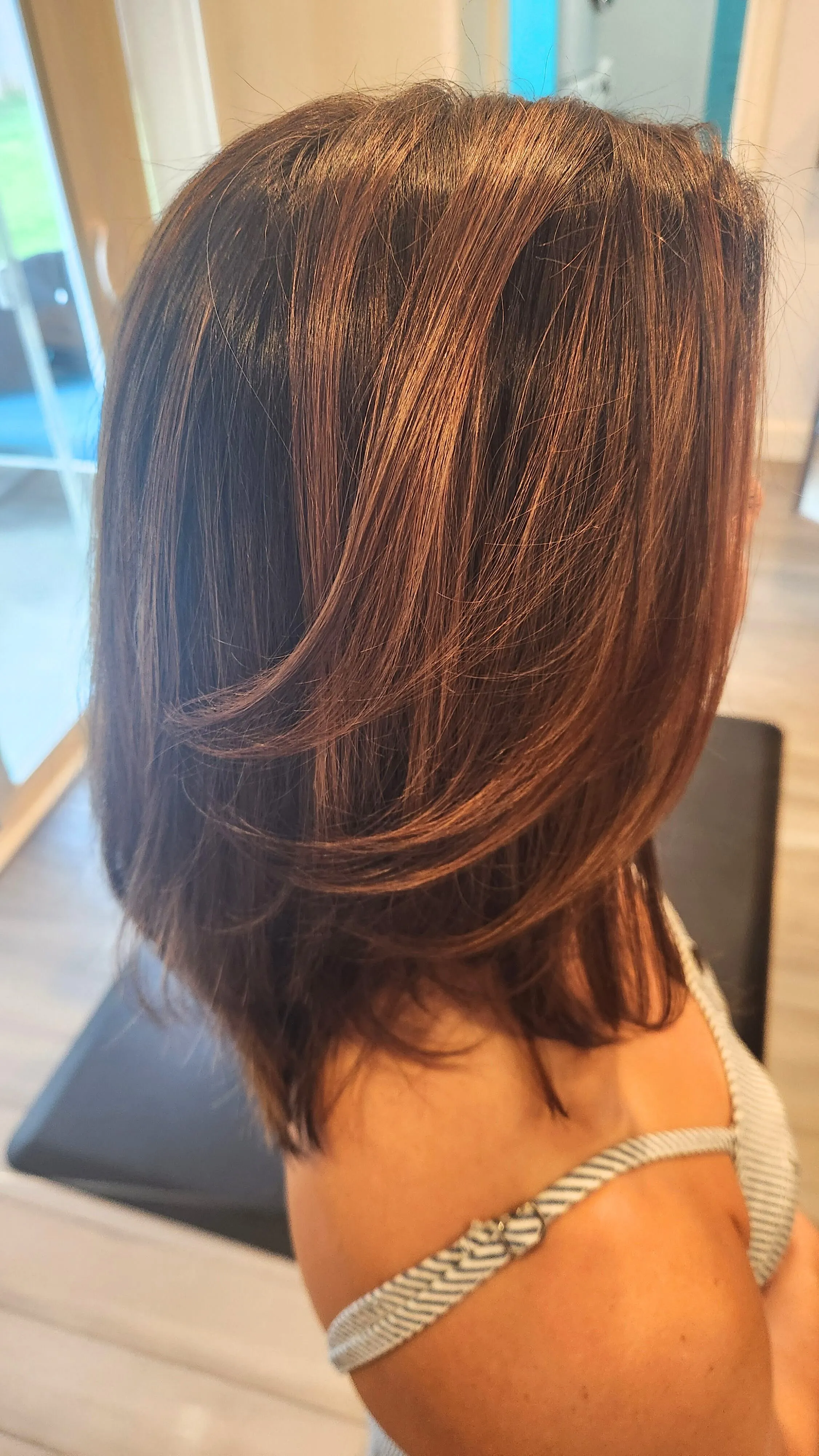 Warm dimensional finished hairstyle with soft movement by Ash Hair Story.